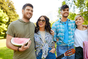 Image showing friends with guitar going to picnic at park