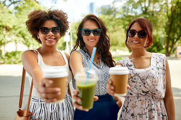 Image showing happy women or friends with drinks at summer park