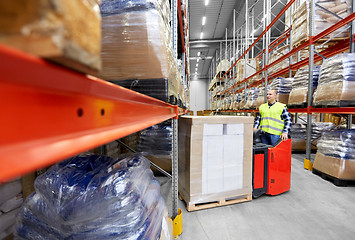 Image showing loader operating forklift at warehouse