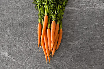 Image showing close up of carrot bunch on table