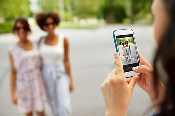 Image showing woman photographing her friends in summer