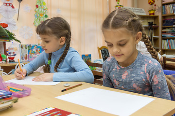 Image showing Schoolgirls at their desks in drawing class