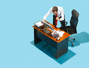 Image showing Shot from above of a stylish business man working on a laptop.