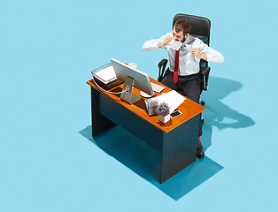 Image showing Shot from above of a stylish business man working on a laptop.