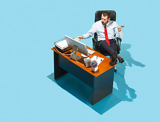 Image showing Shot from above of a stylish business man working on a laptop.