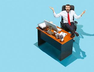 Image showing Shot from above of a stylish business man working on a laptop.