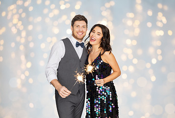 Image showing happy couple with sparklers at party