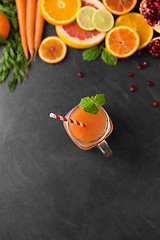 Image showing mason jar glass of fruit juice on slate table top