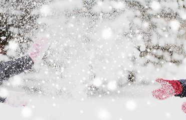 Image showing happy friends playing with snow in winter