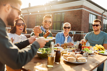 Image showing friends having dinner or bbq party on rooftop