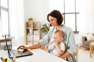 Image showing working mother with baby boy and laptop at home