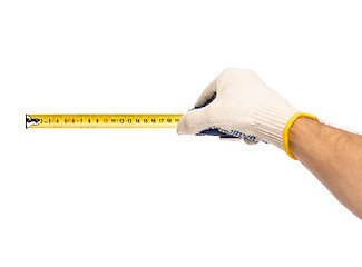 Image showing Hand with glove and tape measure