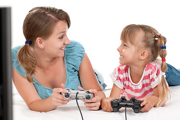 Image showing Mom and daughter playing with Joystick