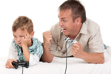 Image showing Dad and son playing with Joystick