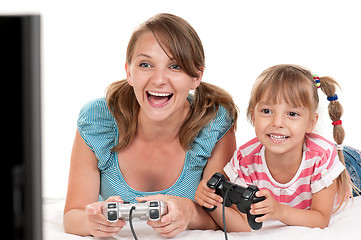 Image showing Mom and daughter playing with Joystick