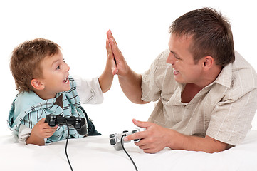 Image showing Dad and son playing with Joystick