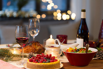 Image showing food and drinks on christmas table at home