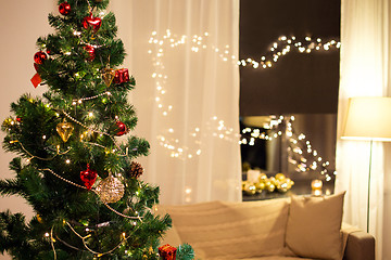 Image showing close up of christmas tree at home in evening