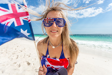 Image showing Australian supporter or fan waving flag on the beach