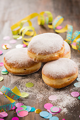 Image showing Krapfen, Berliner or  donuts with streamers and confetti