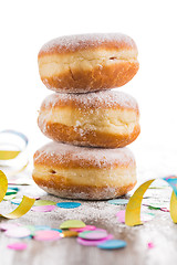 Image showing Krapfen, Berliner or  donuts with streamers and confetti