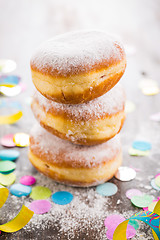 Image showing Krapfen, Berliner or  donuts with streamers and confetti