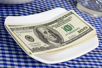 Image showing US currency on a plate

