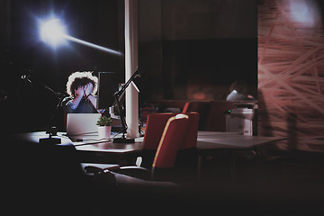 Image showing businessman relaxing at the desk