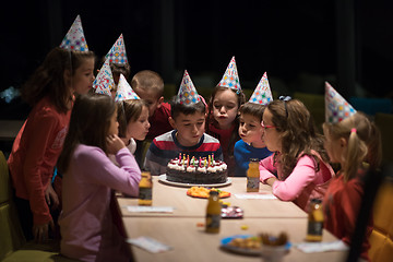 Image showing The young boy joyfully celebrating his birthday