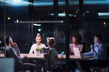 Image showing Multiethnic startup business team in night office