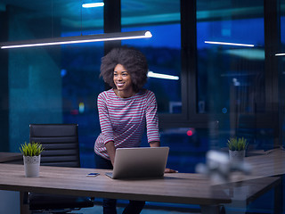 Image showing black businesswoman using a laptop in startup office