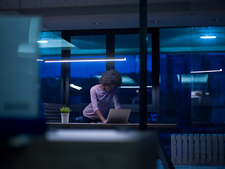 Image showing black businesswoman using a laptop in startup office