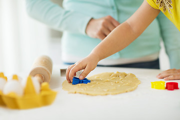 Image showing mother and daughter making cookies at home