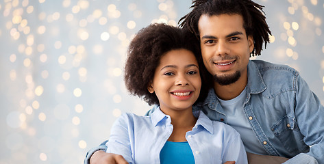 Image showing happy african american couple hugging