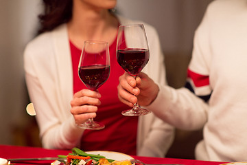 Image showing close up of couple drinking red wine on christmas