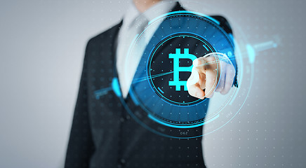 Image showing close up of businessman with bitcoin hologram