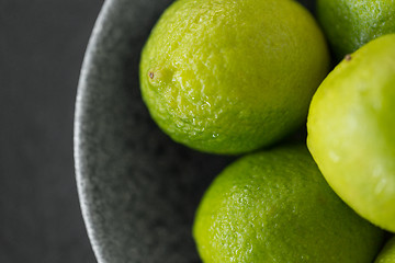 Image showing close up of whole limes in bowl