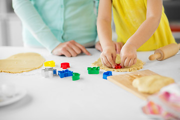 Image showing mother and daughter making cookies at home