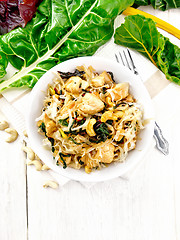 Image showing Funchoza with chard and meat in bowl on board top