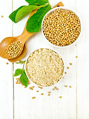 Image showing Flour soy with soybeans and leaf on light board top