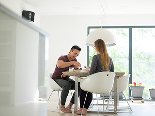 Image showing couple enjoying morning coffee and strawberries