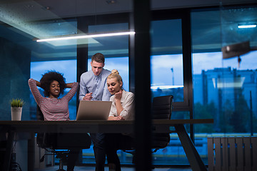 Image showing Multiethnic startup business team in night office