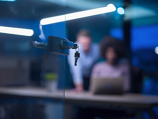 Image showing Multiethnic startup business team in night office