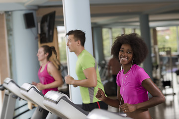 Image showing people exercisinng a cardio on treadmill in gym