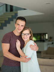 Image showing couple hugging in their new home