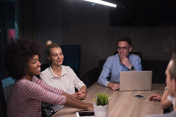 Image showing Multiethnic startup business team in night office