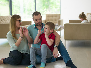 Image showing family with little boy enjoys in the modern living room