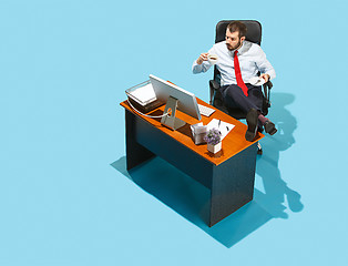 Image showing Shot from above of a stylish business man working on a laptop.