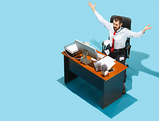 Image showing Shot from above of a stylish business man working on a laptop.