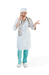 Image showing Beautiful young woman in white coat posing at studio. Full length studio shot isolated on white.